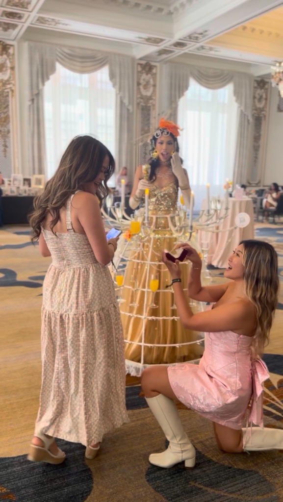 Friends playful proposal at grand event